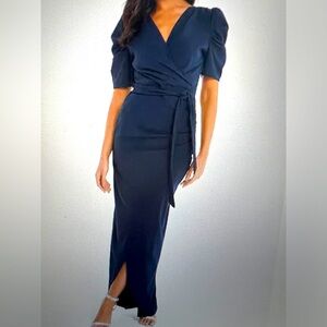 Embrace elegance in this puff sleeved maxi dress. Worn once for 4 hours.